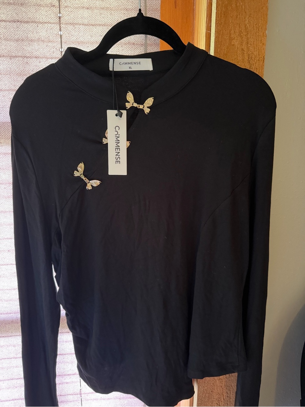 Women’s Black Long-Sleeve Shirt with Gold Butterfly Accents